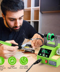 Man using 100W Digital Soldering Station Kit With 2 Helping Hands, Fast Heat, Big LED Display, Temperature Range 180 Celsius To 480 Celsius, Celsius Fahrenheit Conversion, Auto Sleep, Includes Solder Wire And Tools, Green, on a circuit board.