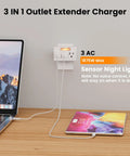 Plenty Of Power Now Super Slim 3 Plug Extender With Soft Led Guide Light 1875W grounded wall splitter in use, charging devices.