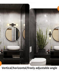 Vintage Edison Vibe Two Light Bathroom Vanity Wall Sconce In Black Finish installed over round mirror in modern bathroom