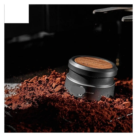Top Shelf Espresso Tamper And Coffee Distributor Combo with dual stainless blades on coffee grounds, highlighting detailed design.