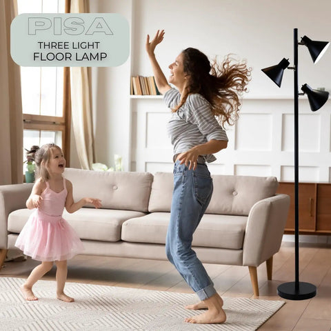 Woman and child dancing in living room with Black Tree Floor Lamp With Three Adjustable Heads For Living Room, Bedroom, And Office