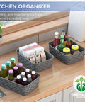 3 Pack Small Plastic Storage Baskets In Sleek Dark Gray For Hassle Free Home Organization And Pantry Reset With Heavy Duty Wicker Look Design A Fast Fix For Bedroom Kitchen Laundry Cabinet Countertop on wooden countertop with food items.