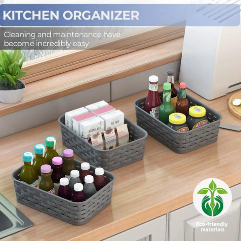 3 Pack Small Plastic Storage Baskets In Sleek Dark Gray For Hassle Free Home Organization And Pantry Reset With Heavy Duty Wicker Look Design A Fast Fix For Bedroom Kitchen Laundry Cabinet Countertop on wooden countertop with food items.