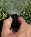 Adjusting Four Inch Pop Up Sprinkler Heads Set Of Five With Adjustable 0 To 360 Degree Arc Nozzle Pattern, spraying water