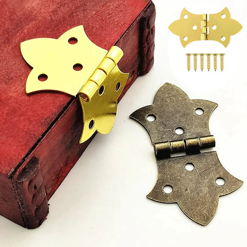 Set Of Six Mini Butterfly Cabinet Hinges In Classic Antique Gold With Included Mounting Screws For Wood Boxes Jewelry Crafts And Furniture Diy No Sweat Install And Built Tough attached to a wooden box.