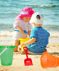 Children playing with Six Piece Beach Buckets and Shovels Set for Kids, 7.6 Inch Pails and Shovels, great for sand castles and beach fun