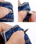 Close-up of silver cone spike screw-back stud being installed on denim jeans; 7x14mm, set of 10.