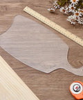 Slick Acrylic Charcuterie Board Router Template For Woodworking Cutting Board Stencil on a workbench with ruler.