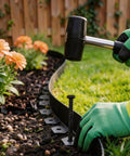 Installing No Dig Landscape Edging Kit 1.5 Inch By 100 Foot With 150 Spikes, Hammer And Gloves next to garden bed