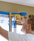 Person using Hand Masker Painter Tape And Masking Film Dispenser Kit For Fast Masking Prep With A 12 Inch Blade And Surface Safe Tape Film Set