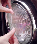 Applying Clear Duct Tape Tough As Nails Heavy Duty All Purpose Weatherproof Repair Tape to car headlight
