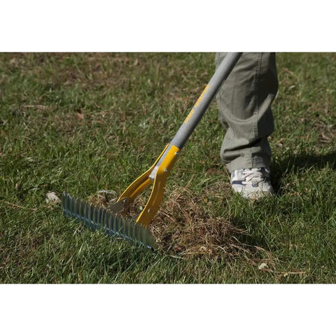 Person using Thatch Rake For Lawns With Curved Steel Tines 15 Inch Brown All In One Lawn Care Tool For Dethatching Aerating Seeding