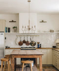 Kitchen with Roma 22 Inch 5-Light French Country Chandelier With Adjustable Height And Smoked Cedar Finish above island.