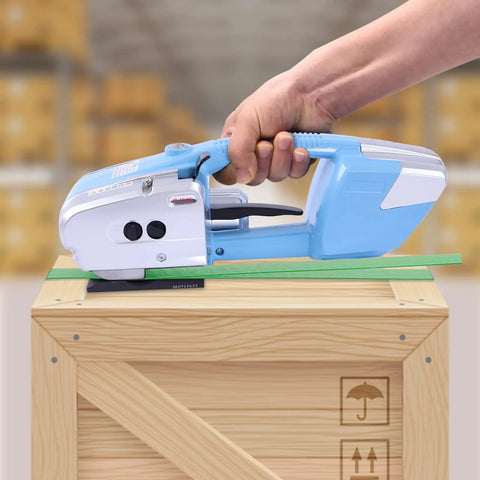 Top Tier Electric Strapping Machine For Boxes And Pallets With 3000 Mah Battery Power Automatic Tension Cut Tool For One Half To Five Eighths Inch Pp Pet Straps Sleek Blue Setup No Sweat Workhorse in use on wooden crate.