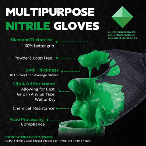 Black nitrile disposable glove with diamond texture; large size, green paint splashes on the glove.