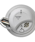 Top Shelf Game Changer Smoke And Carbon Monoxide Detector With Heavy Duty Ionization Chip And Nine Volt Battery Plug And Play Setup Interconnect Ready For Total Home Safety, white ceiling mounted unit with battery.