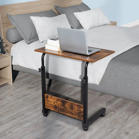 Rock Solid Height Adjustable Computer Desk With Smooth Rollin Casters For Easy Repositioning And Firm Lockdown Heavy Duty Steel Top crafted as a compact standing laptop station by the bed.