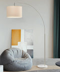 Modern Arc Floor Lamp With Brushed Steel Arch And Silver Finish Hanging Drum Shade Over Sofa For Reading In Living Room Or Bedroom Corner Standing Light To Add Cozy Glow And Contemporary Style