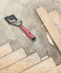 Floor Lifter Pro Demolition Tool For Easy Removal Of Hardwood Floors Ceramic Tile Trim And Countertops next to removed floorboards