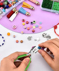 Hands using 6 In 1 Jewelry Pliers Set For Beading And Wire Crafting 2 Piece Kit Bail Making Pliers For Looping Shaping Wire DIY Jewelry Making Tools Durable Carbon Steel With Rubber Grip with colorful beads and charms.