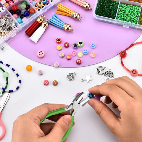 Hands using 6 In 1 Jewelry Pliers Set For Beading And Wire Crafting 2 Piece Kit Bail Making Pliers For Looping Shaping Wire DIY Jewelry Making Tools Durable Carbon Steel With Rubber Grip with colorful beads and charms.