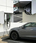 Boss Level Hella Tough All Season Ev Charger Cover Wall Mount Box Guards Electric Vehicle Plug Against Brutal Rain Snow Sun Uv Damage Easy Install Sturdy Galvanized Steel Design mounted on wall with electric vehicle charging.