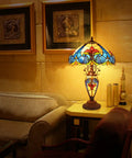 Retro Tiffany Style Table Lamp With Stained Glass, 24 Inches Tall in living room setting, orange glow, 3 LED bulbs