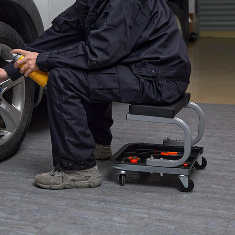Mechanic using Rolling Creeper Seat For Garage And Shop, Padded Mechanic Stool With Tool Tray Storage, 250 Lb Capacity, steel frame, black.