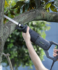 Heavy Duty Corded Reciprocating Saw 120V With 6.0 Amp Motor And 2800 RPM cutting through tree branch in hand.