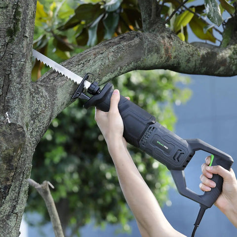 Heavy Duty Corded Reciprocating Saw 120V With 6.0 Amp Motor And 2800 RPM cutting through tree branch in hand.