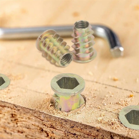 Heavy Duty Zinc Plated Hex Socket Cup Nuts For Wood And Drywall M6 M8 M10 Threaded Inserts on wood with an L-key tool.