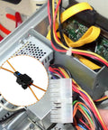 Two Velidy fiber optic loop bypass adapters with orange wires in a vehicle wiring harness