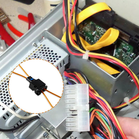 Two Velidy fiber optic loop bypass adapters with orange wires in a vehicle wiring harness