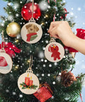 Thirty Pack Fresh Three Inch Round Blank Wood Circles With Natural Twine Hangers Premium Birch Plywood Crafting Pendants on a Christmas tree.