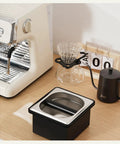 Built Like A Tank Stainless Steel Knock Box With Removable Interior Grounds Bin For Espresso Setups and Home Baristas on a countertop.
