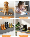 Dog sitting on Under Sink Waterproof Silicone Cabinet Mat 34 Inch by 22 Inch, Thick Edge Protector for kitchen and bathroom use.