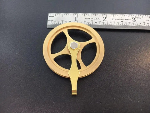 Replacement Grandfather Clock Pulley for Cable Movements One And Three Quarters Inch DIY Clock Assembly Kit next to ruler