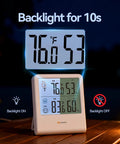 Wireless Indoor Outdoor Thermometer Hygrometer With Outdoor Sensor displaying temperature and humidity on backlit LCD at night