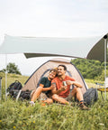 Couple camping under Beach Tent Poles Replacement 6.56 Ft Foldable Aluminum Alloy Tarp Poles with Ground Stakes for outdoor fun