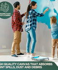 Family painting walls with Canvas Drop Cloth Set 14x16 Feet For Painting And DIY Projects on floor to protect from spills.