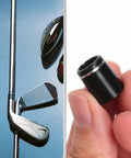 Universal Black Golf Club Ferrules For Iron Shafts, 12 Pack With Single Silver Ring, 0.355 Inch Tip held in hand near golf club