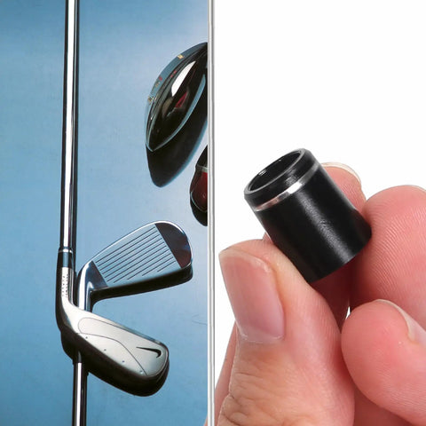 Universal Black Golf Club Ferrules For Iron Shafts, 12 Pack With Single Silver Ring, 0.355 Inch Tip held in hand near golf club