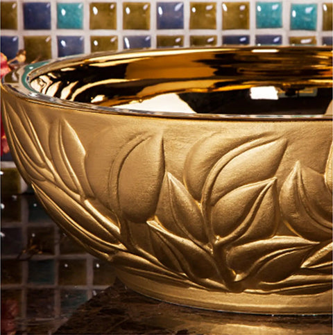 Close-up of Super Slick Round Vessel Sink For Bathroom Vanity Killer Gold Ceramic Countertop Wash Basin with leaf design.