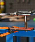 High Carbon Steel Fractional Plug Tap 3/4-10 NC installed on a workbench for threading, ideal for hand and machine tools.