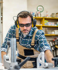 Man in workshop wearing 10 Pack Tinted Safety Glasses ANSI Z87.1 Scratch Resistant Eye Protection For Men And Women Wraparound Goggles