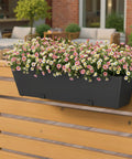 Tough As Nails Two Pack Metal Railing Planter Box 36 Inch Heavy Duty Rustproof Powder Coated Steel Flower Pot with flowers on a railing.