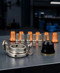 Tough As Nails 12 Piece Plasma Torch Parts Kit Featuring Copper Alignment Nozzles and Silver Secure Socket Electrodes on Workshop Table.