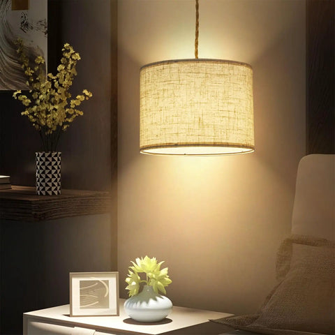 Plug In Pendant Lights With Smooth Dimmer Switch And 15 Foot Braided Hemp Cord For Super Chill Bedroom Or Living Room Vibes Two Pack Quick Hook Up Beige Linen Shades illuminated over a bedside table with decor.