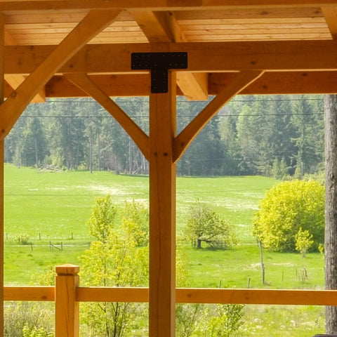 4 Pcs T Post Bracket Set With 16.9 by 5 Inch T Flat Mending Plates installed on wooden pavilion framing outdoors
