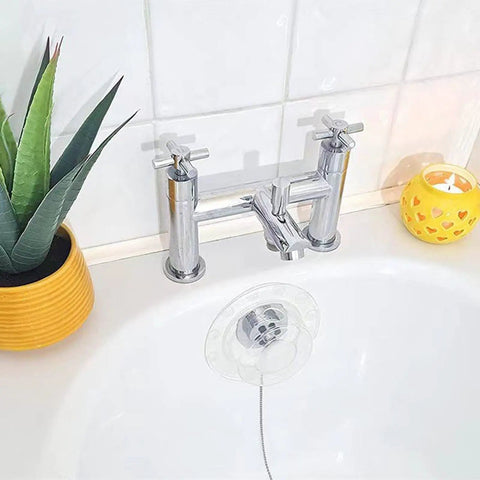 Bathtubs Drain Stoppers with Leakproof Designs, Clear positioned near faucet in modern bathroom setting with plants.